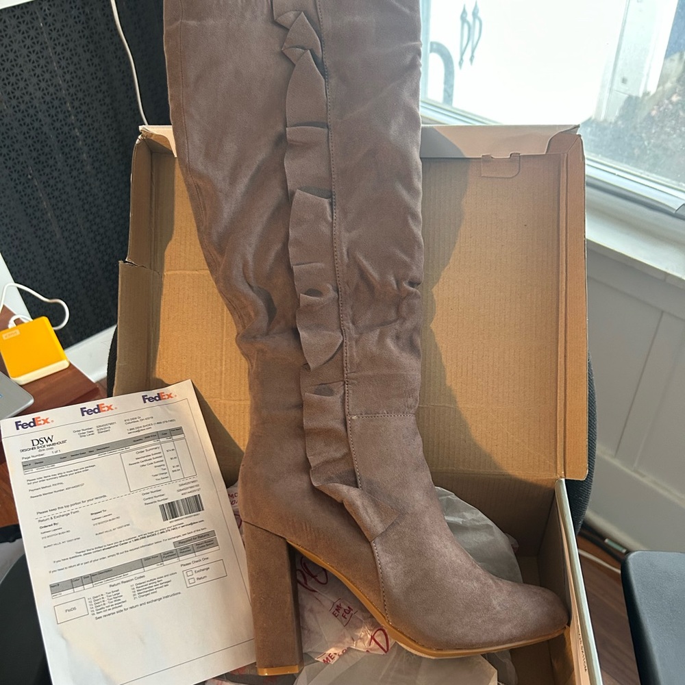 Woman’s vegan suede tall boots with decorative ruffle.